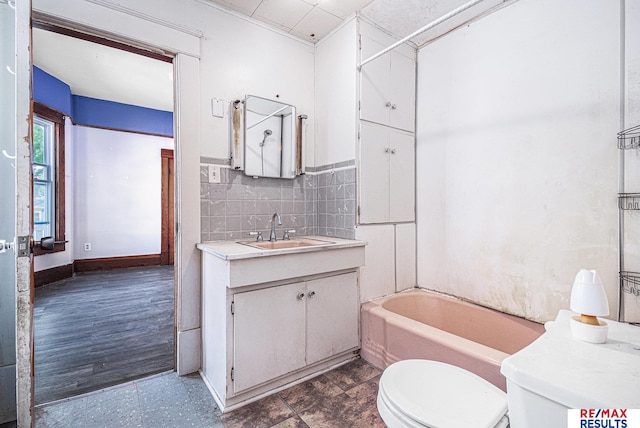 240 E 15th St, Fremont, NE 68025 - full bath with vanity, toilet, and backsplash