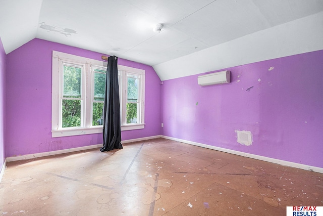 240 E 15th St, Fremont, NE 68025 - additional living space featuring a wall unit AC, lofted ceiling, and baseboards