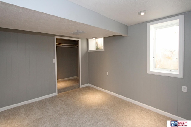 4530 N 72nd St, Lincoln, NE 68507 - unfurnished bedroom featuring carpet floors, baseboards, a closet, and a textured ceiling