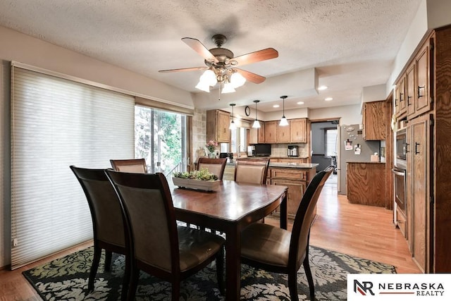 15708 Leavenworth St, Omaha, NE 68118 - dining space featuring light wood-style flooring, ceiling fan, a textured ceiling, and recessed lighting