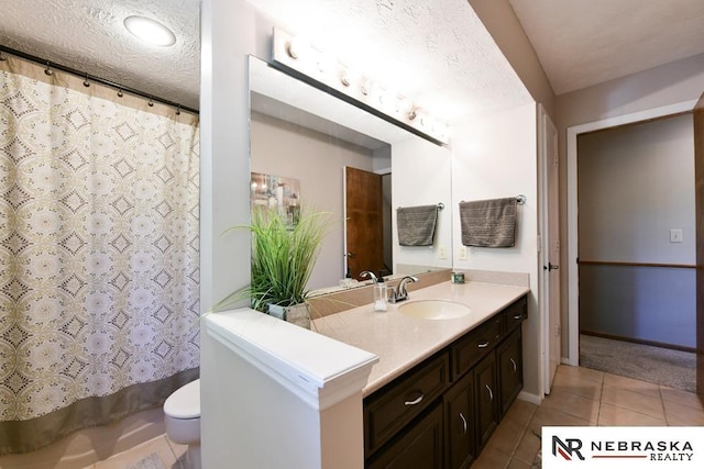 15708 Leavenworth St, Omaha, NE 68118 - bathroom featuring vanity, toilet, tile patterned flooring, a textured ceiling, and a shower with shower curtain