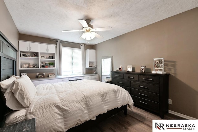 15708 Leavenworth St, Omaha, NE 68118 - bedroom featuring wood finished floors, a textured ceiling, ceiling fan, and baseboards