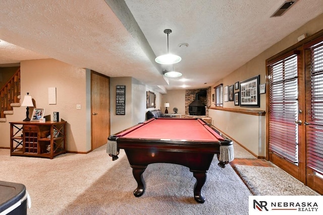 15708 Leavenworth St, Omaha, NE 68118 - rec room featuring a textured ceiling, a wood stove, baseboards, carpet flooring, and billiards table