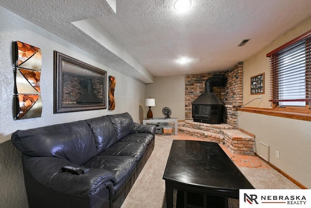 15708 Leavenworth St, Omaha, NE 68118 - living room with a textured ceiling, a wood stove, and carpet flooring