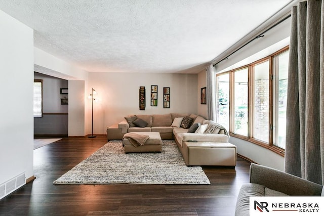 15708 Leavenworth St, Omaha, NE 68118 - living area with a textured ceiling, baseboards, and dark wood-style floors