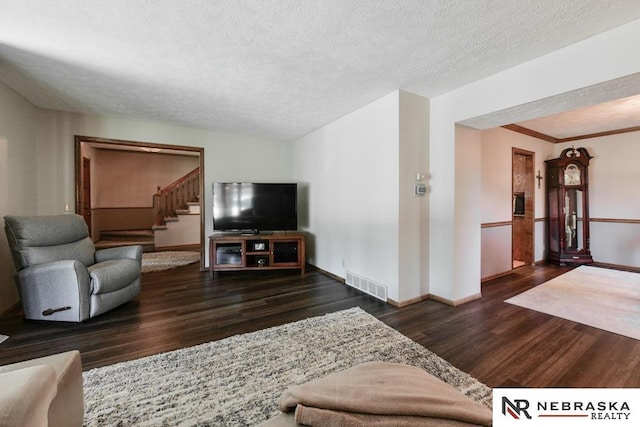 15708 Leavenworth St, Omaha, NE 68118 - living room featuring wood finished floors, stairway, a textured ceiling, and baseboards