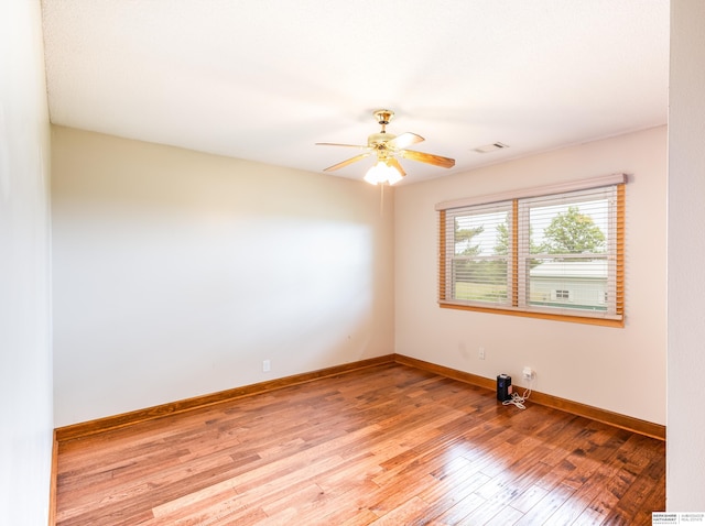 13205 N 192nd St, Bennington, NE 68007 - spare room featuring a ceiling fan, light wood-type flooring, and baseboards
