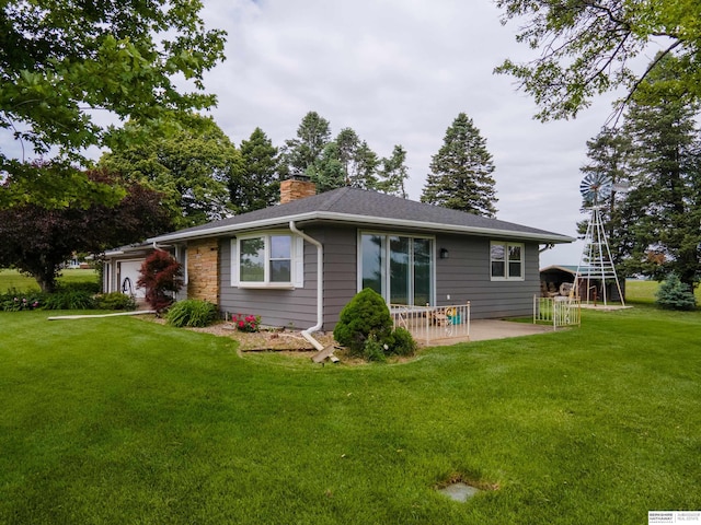 13205 N 192nd St, Bennington, NE 68007 - rear view of house featuring a chimney, a lawn, an attached garage, and a patio