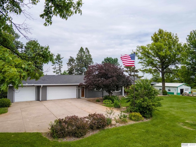 13205 N 192nd St, Bennington, NE 68007 - view of front of house featuring a front yard, driveway, and an attached garage