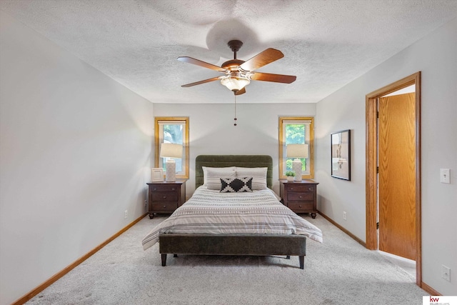 14460 Patrick Ave, Omaha, NE 68116 - bedroom featuring a textured ceiling, light colored carpet, baseboards, and ceiling fan