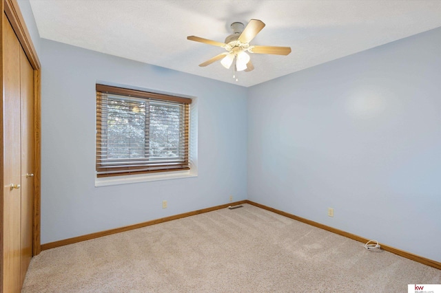 14460 Patrick Ave, Omaha, NE 68116 - empty room with carpet, a ceiling fan, and baseboards