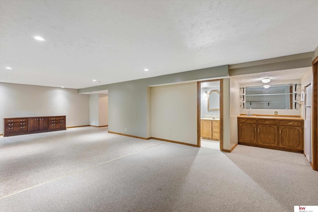 14460 Patrick Ave, Omaha, NE 68116 - finished basement with light colored carpet, baseboards, and recessed lighting