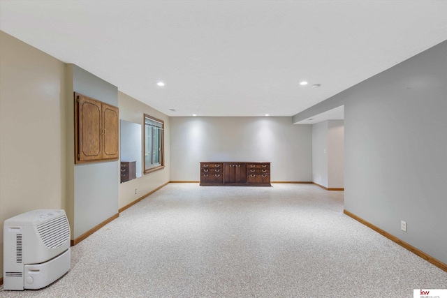 14460 Patrick Ave, Omaha, NE 68116 - unfurnished living room featuring baseboards and recessed lighting