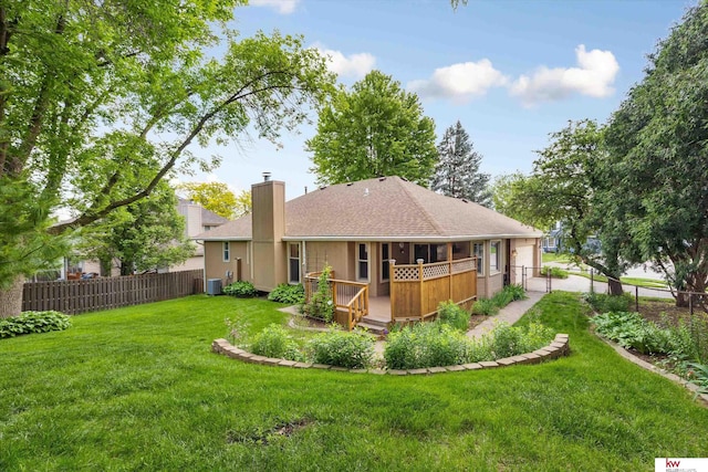 14460 Patrick Ave, Omaha, NE 68116 - rear view of property with a chimney, a shingled roof, central AC unit, and a wooden deck