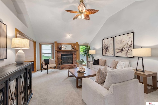 14460 Patrick Ave, Omaha, NE 68116 - living room with vaulted ceiling, ceiling fan, a fireplace, and light colored carpet