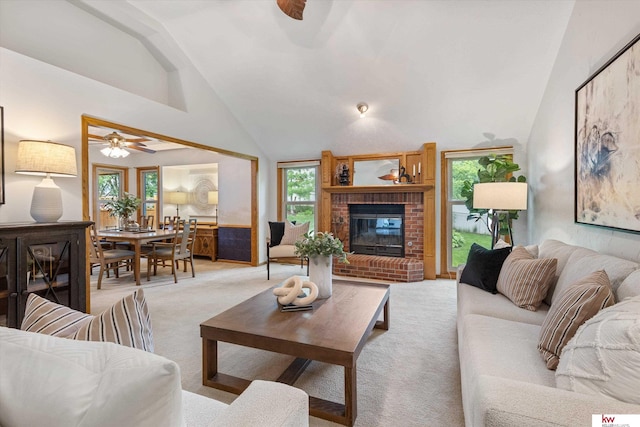 14460 Patrick Ave, Omaha, NE 68116 - living area with a ceiling fan, light carpet, a brick fireplace, and high vaulted ceiling
