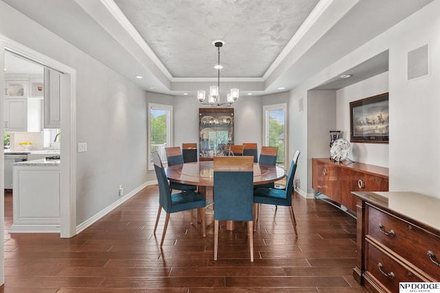 15921 Lake St, Omaha, NE 68116 - dining area featuring a tray ceiling, dark wood-type flooring, a chandelier, plenty of natural light, and recessed lighting