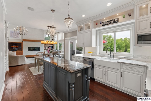 15921 Lake St, Omaha, NE 68116 - kitchen with appliances with stainless steel finishes, a chandelier, a sink, white cabinets, and recessed lighting