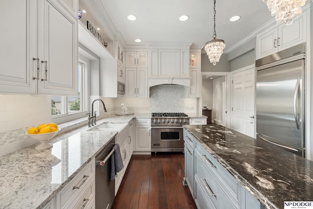 15921 Lake St, Omaha, NE 68116 - kitchen featuring built in appliances, a sink, a chandelier, white cabinets, and recessed lighting