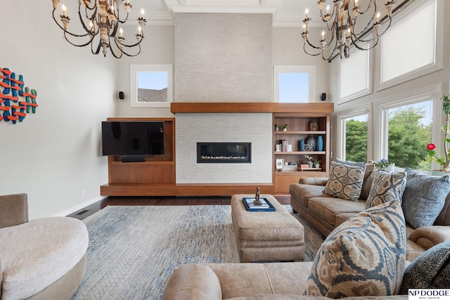 15921 Lake St, Omaha, NE 68116 - living area with a chandelier, a towering ceiling, ornamental molding, wood finished floors, and baseboards