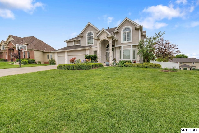 15921 Lake St, Omaha, NE 68116 - traditional-style house featuring driveway, brick siding, an attached garage, and roof with shingles