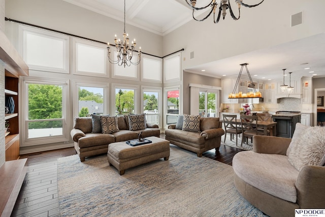 15921 Lake St, Omaha, NE 68116 - living room featuring a chandelier, wood-type flooring, a towering ceiling, crown molding, and recessed lighting