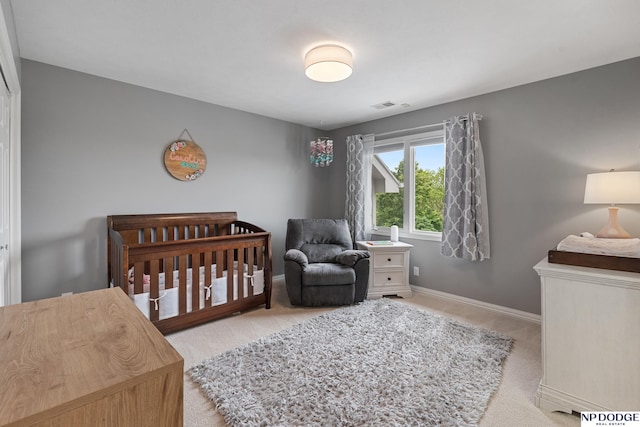 15921 Lake St, Omaha, NE 68116 - carpeted bedroom with baseboards and a crib