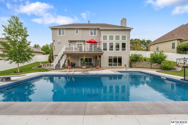 15921 Lake St, Omaha, NE 68116 - rear view of house with stairs, a wooden deck, a chimney, and a patio area