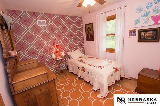 3840 X St, Lincoln, NE 68503 - bedroom with wood finished floors and a ceiling fan