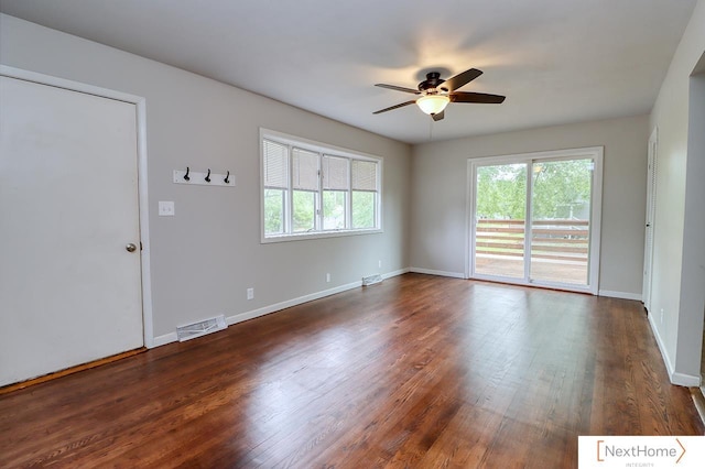 3831 S 54th St, Lincoln, NE 68506 - unfurnished room featuring a ceiling fan, dark wood-style flooring, and baseboards