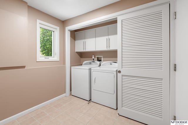 9911 Devonshire Dr, Omaha, NE 68114 - washroom featuring cabinet space, washing machine and clothes dryer, and baseboards