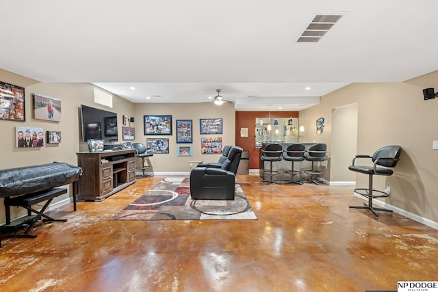 9911 Devonshire Dr, Omaha, NE 68114 - living area with concrete flooring, baseboards, recessed lighting, and bar area