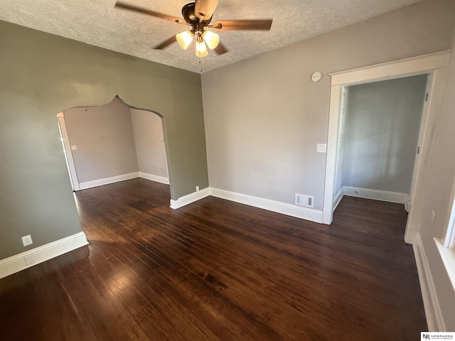 1322 S 21st St, Omaha, NE 68108 - spare room with ceiling fan, a textured ceiling, hardwood / wood-style floors, baseboards, and arched walkways