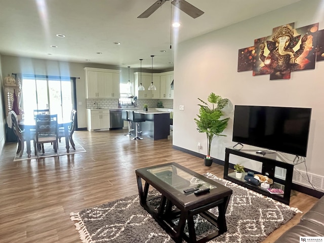 1001 Trail Dr, Valentine, NE 69201 - living area featuring wood finished floors, recessed lighting, baseboards, and a ceiling fan