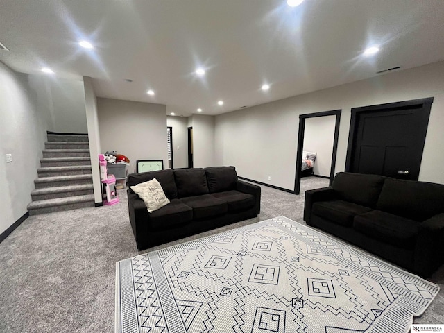 1001 Trail Dr, Valentine, NE 69201 - living room featuring light colored carpet, stairway, baseboards, and recessed lighting
