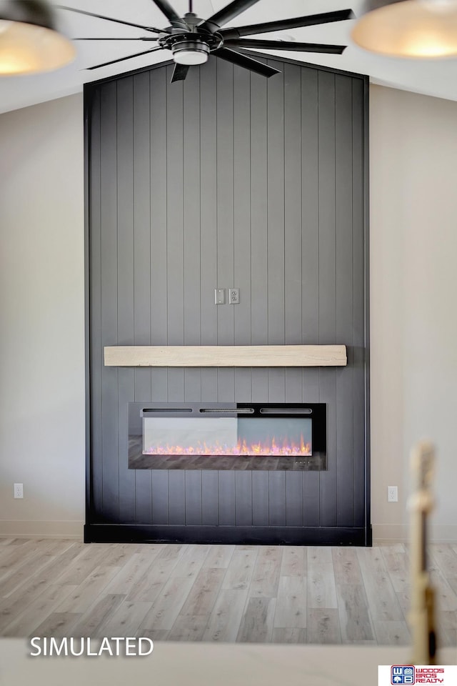 9350 S 86th St, Lincoln, NE 68526 - detailed view of a fireplace, wood finished floors, a ceiling fan, and baseboards
