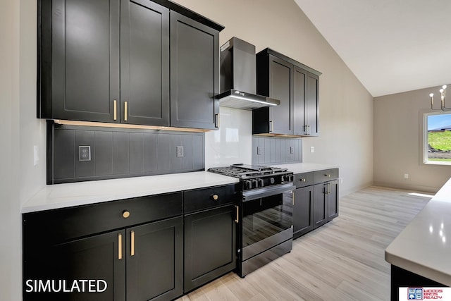 9350 S 86th St, Lincoln, NE 68526 - kitchen with gas stove, wall chimney range hood, lofted ceiling, light wood-style floors, and light countertops