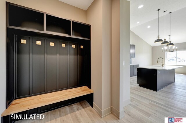 9350 S 86th St, Lincoln, NE 68526 - mudroom featuring light wood finished floors, lofted ceiling, recessed lighting, a sink, and baseboards