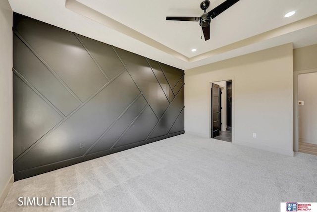 9350 S 86th St, Lincoln, NE 68526 - carpeted spare room with a ceiling fan, recessed lighting, baseboards, a tray ceiling, and a decorative wall
