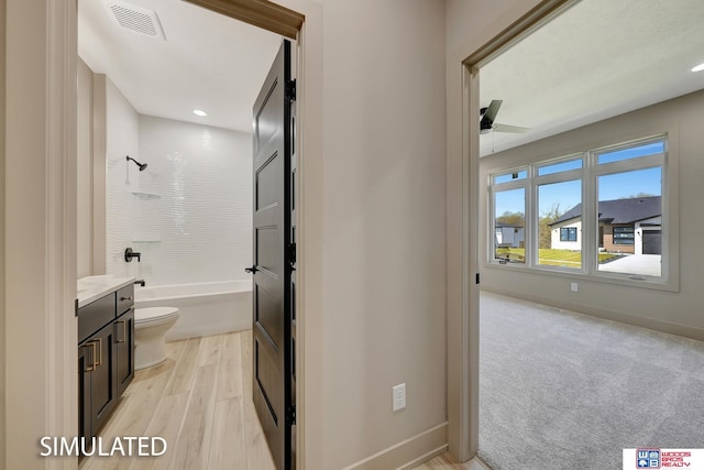 9350 S 86th St, Lincoln, NE 68526 - bathroom featuring toilet, vanity, a ceiling fan, baseboards, and recessed lighting