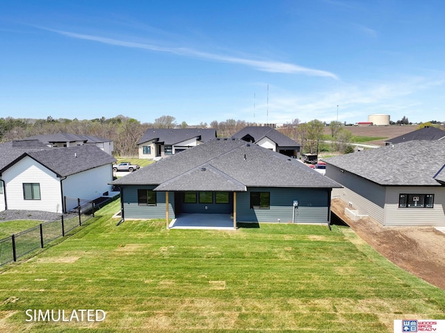 9350 S 86th St, Lincoln, NE 68526 - back of property featuring a patio, roof with shingles, and a residential view