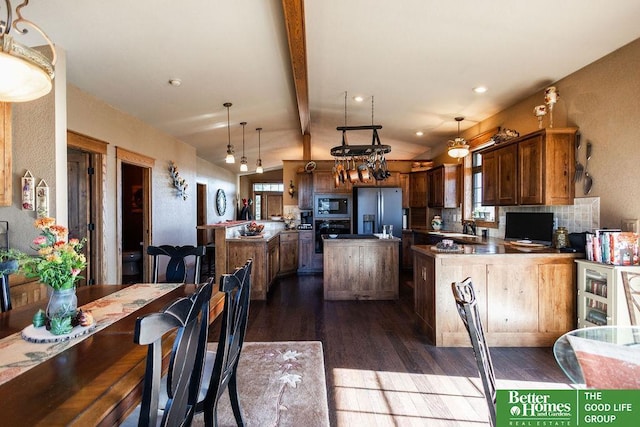 3860 Shady Bend Rd, Grand Island, NE 68801 - kitchen with built in microwave, stainless steel fridge, dark wood-style flooring, a sink, and a kitchen island