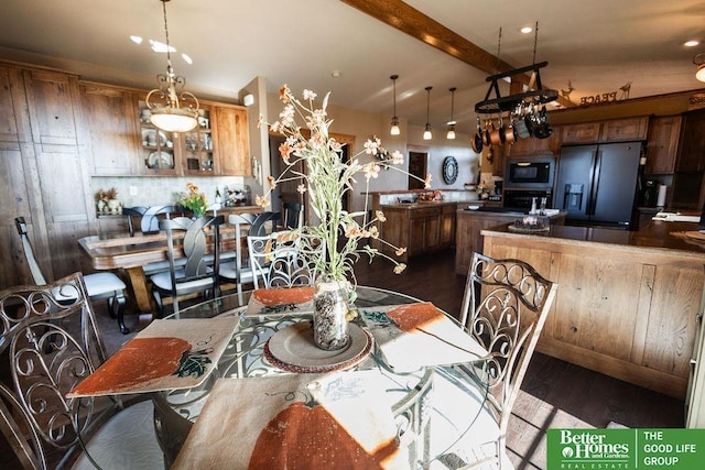 3860 Shady Bend Rd, Grand Island, NE 68801 - dining space featuring dark wood-type flooring and beamed ceiling