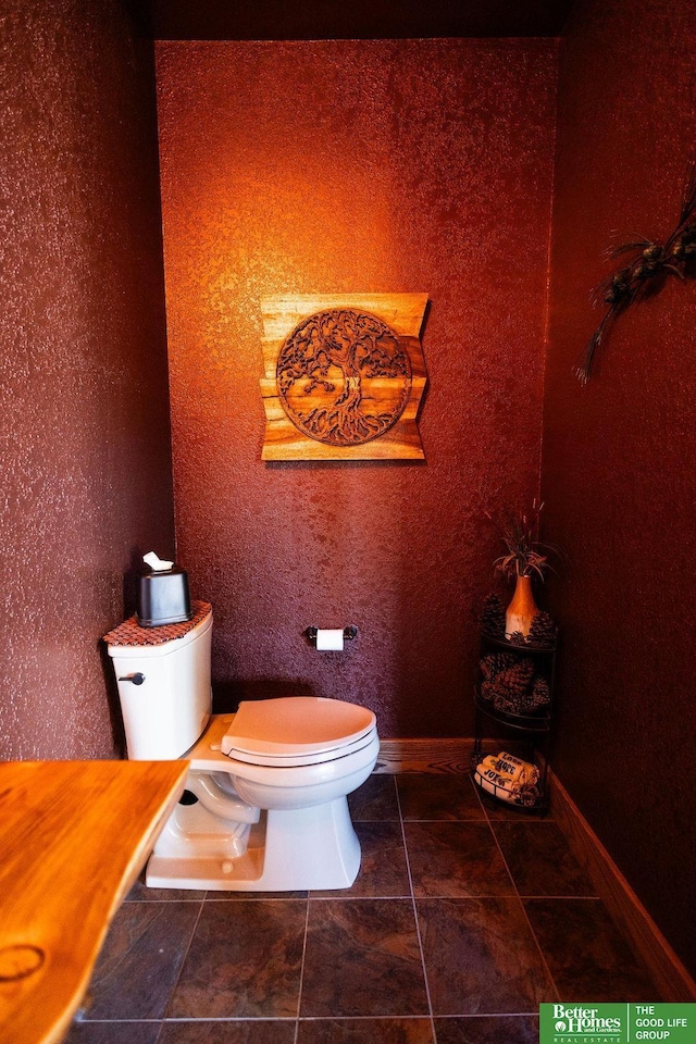 3860 Shady Bend Rd, Grand Island, NE 68801 - bathroom featuring toilet, baseboards, and tile patterned flooring