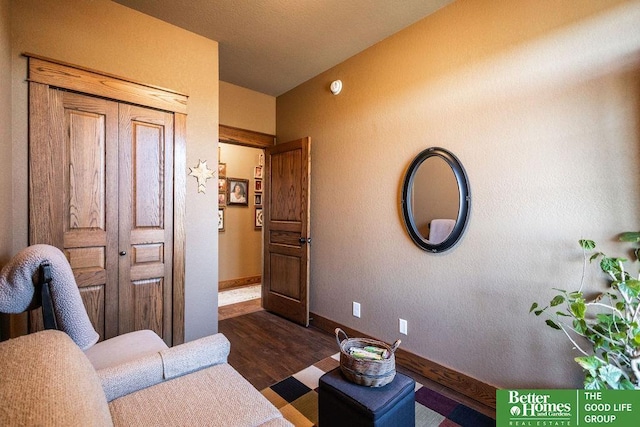3860 Shady Bend Rd, Grand Island, NE 68801 - living room featuring dark wood-style flooring and baseboards