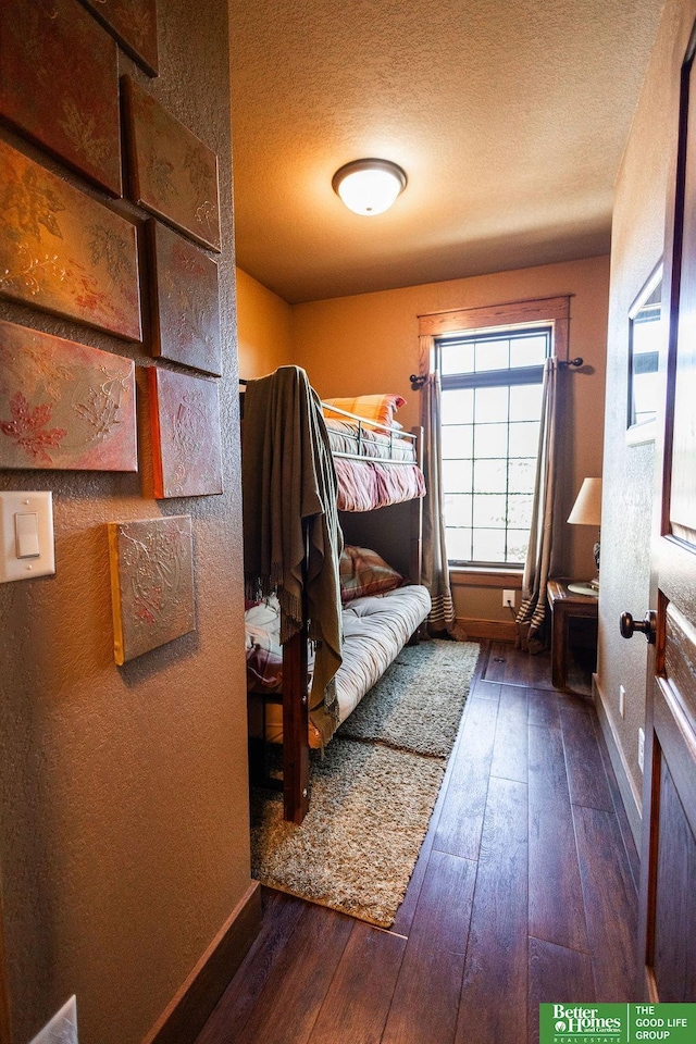 3860 Shady Bend Rd, Grand Island, NE 68801 - bedroom featuring wood-type flooring, baseboards, and a textured ceiling
