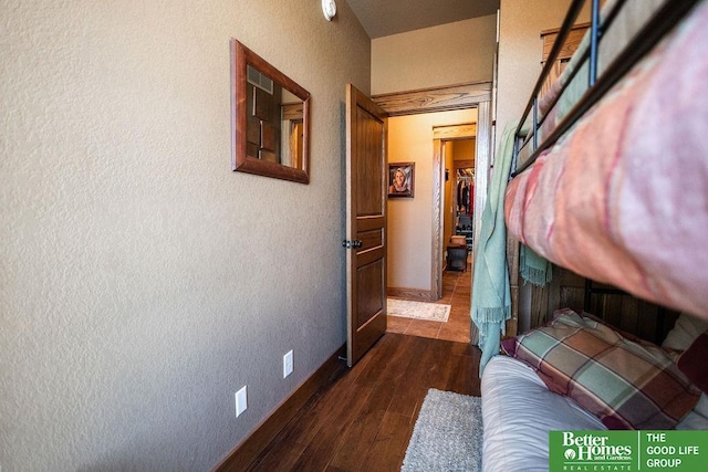 3860 Shady Bend Rd, Grand Island, NE 68801 - hallway with dark wood finished floors, a textured wall, and baseboards