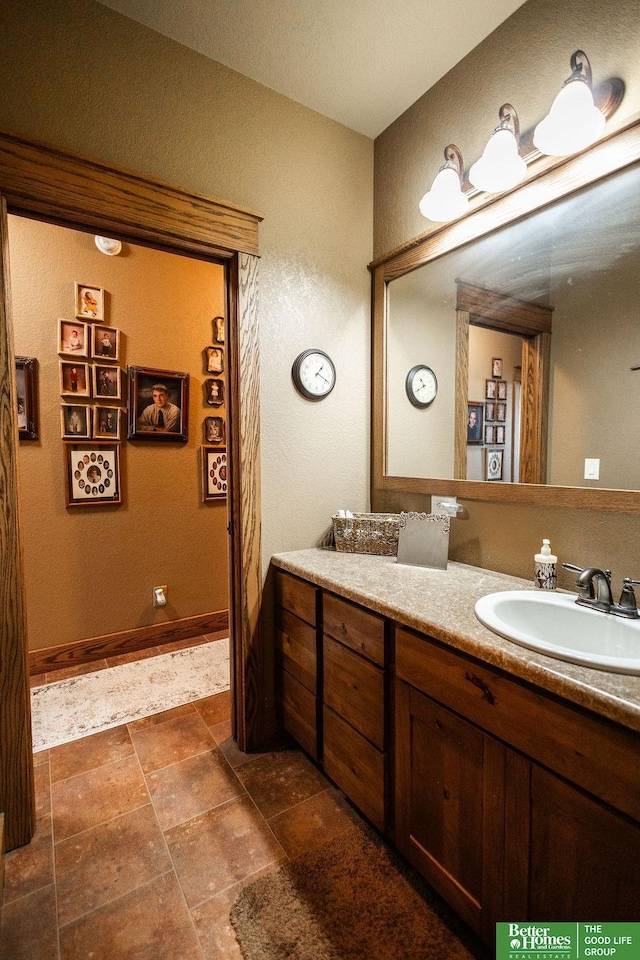 3860 Shady Bend Rd, Grand Island, NE 68801 - bathroom featuring vanity and baseboards