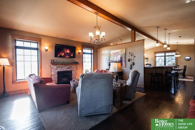 3860 Shady Bend Rd, Grand Island, NE 68801 - living room with hardwood / wood-style floors, a stone fireplace, a chandelier, and baseboards