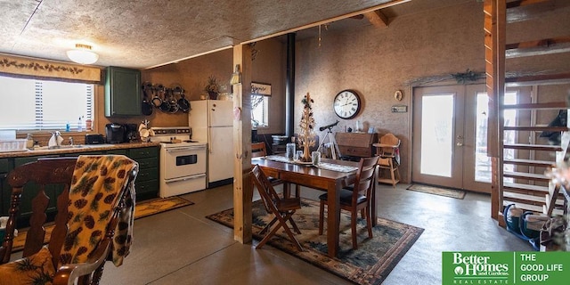 3860 Shady Bend Rd, Grand Island, NE 68801 - dining area featuring plenty of natural light, french doors, and concrete flooring